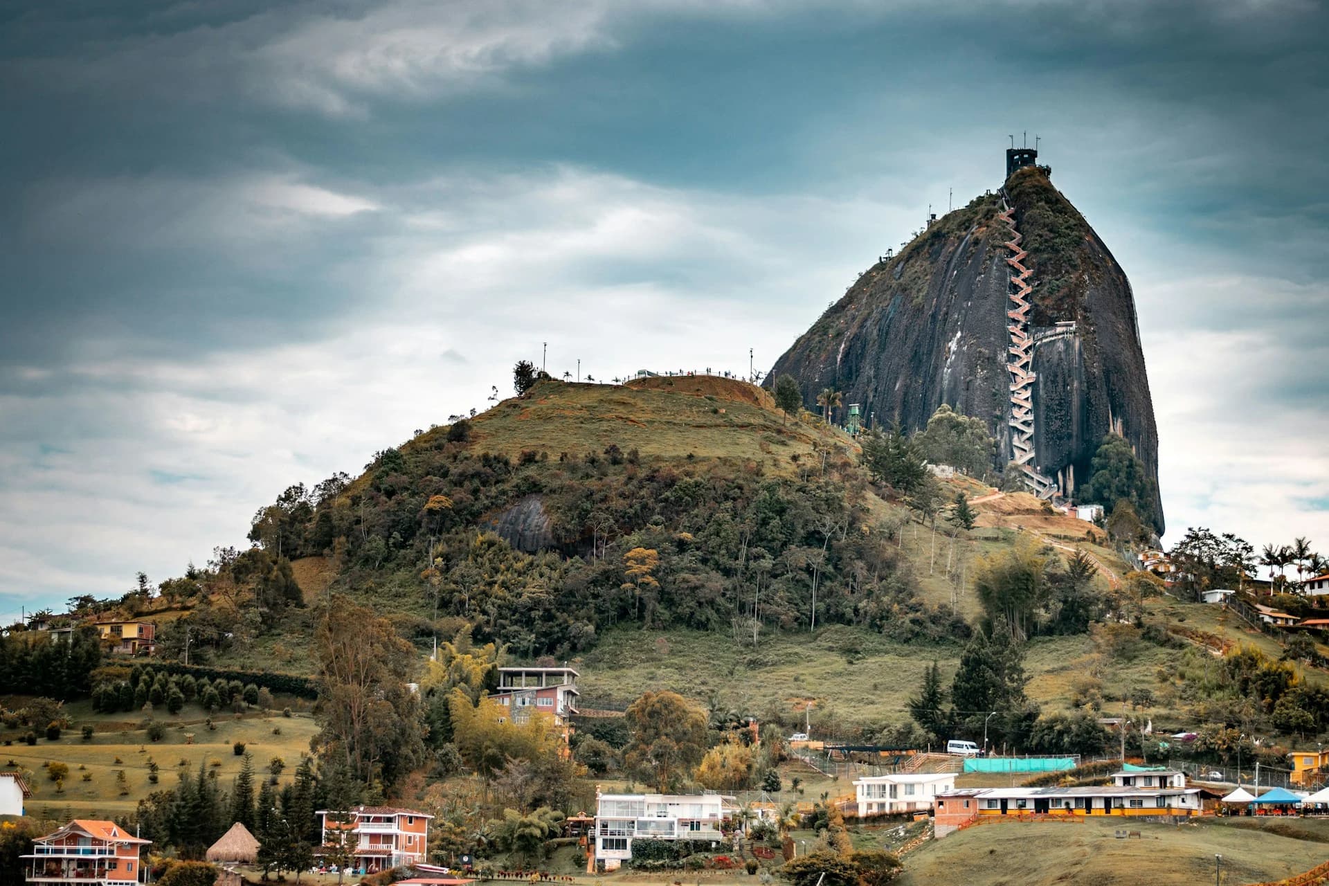 View of El Peñol in Guatapé, Colombia under a bright blue sky